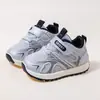 Zapatos Infantiles Suaves Forrest Gump 2026 Otoño Nuevas Zapatillas Deportivas para Correr para Niños Mayores Moda Versátil Zapatos de Entrenamiento Alemanes