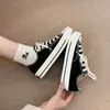 Zapatillas clásicas de lona vulcanizada para mujer, nuevas zapatillas versátiles para estudiantes primavera 2026, versión coreana ins zapatos casuales para mujer