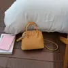 Bolsa de Mão de Alta Qualidade com Padrão Lichia para Mulheres 2026 Nova Versátil Cor Sólida Elegante Bolsa de Ombro Transversal concha