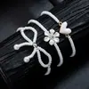 Moda Creativa Dulce Cuentas de Arroz Blanco Perla de Imitación Trenzado Lazo Flor Aleación Amor Elástico Pulsera para Dama