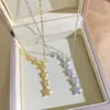 Nuevo y deslumbrante collar de acero de titanio con forma de estrella para mujer, moderno con incrustaciones de circonita, seis estrellas, cadena para la clavícula con borla, joyería transfronteriza