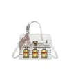 2026 Verano Nuevo Gran Capacidad Lujo Ligero Hebilla de Candado Simple Moda Elegante Retro Bolso de Mano para Viajes Diarios Bolso de Hombro Cruzado