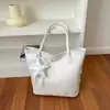 Bolso tote tejido de estilo europeo y americano de gran capacidad con colgante de encaje de estrella, bolso de hombro versátil para estudiantes, bolso de mano, bolso de axila