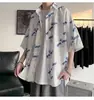 Verão Ins Design Sense Impresso Camisa de manga curta Moda Masculina Estilo Coreano Na moda plus size Camisa de meia manga solta Roupas