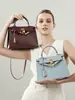 Uau Oh CAIXA couro de boi mini bolsa de mão versão alta costura bolsa Kelly segunda geração novo estilo sensação de luxo bolsa transversal de couro genuíno
