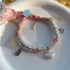 Método antiguo cuerda rosa enrollada pulsera tejida de Xizang pulsera con candado de paz Xiangyun estilo étnico retro joya de mano versátil