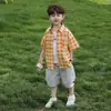 Traje de Verano para Niños 2026 Estilo Nuevo Conjunto de Dos Piezas de Camisa de Manga Corta de Verano para Niños Ropa de Trabajo de Cuadros de Verano para Bebé