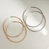 Pendientes geométricos de aro liso exagerados con aguja plateada pendientes de diseño simple pendientes de temperamento transfronterizos europeos y americanos para mujer