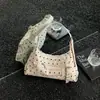 Textura de nicho color retro bloque de color lunares 2026 otoño nuevo elegante simple gran capacidad versátil bolso de hombro cruzado