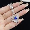 Anillo, collar y pendientes elegantes de alta calidad con microincrustaciones de circón azul de doble flor de nicho retro europeo y americano de Sri Lanka
