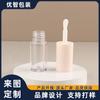 En existencias Tubo transparente de brillo labial redondo y corto, tubo de miel para labios, tubo de aceite labial, cabezal de cepillo grande, tubo de líquido reparador.
