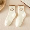 Calcetines gruesos de otoño e invierno para mujer, calcetines de tubo acolchados de felpa, calcetines Terry lindos con cara sonriente, calcetines sueltos para la nieve al por mayor