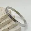 Pulsera de Acero de Titanio para Mujer Moda Simple Estilo Nuevo Oro 18K Múltiples Círculos Nervados Incrustaciones Circonita Redonda Blanca Pulsera