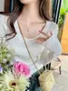 Suéter gris de cuello redondo bajo para mujer, capa base, ropa interior, nuevo estilo otoño e invierno, top de punto de manga larga ajustado