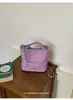 Bolso de Mano Trenzado de Moda Transfronterizo de Nicho Tipo Cubo para Mujer 2026 Nuevo Versátil Cadena Exterior Hombro Cruzado