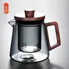 Al por mayor en stock Pantalla de filtro de vidrio resistente a altas temperaturas de borosilicato alto tetera para infusión incorporada separador de té olla individual