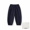 Ropa infantil Anyang colección otoño pantalones casuales para niños pantalones deportivos color liso pantalones largos nuevos pantalones bordados pantalones jogger para niños modernos