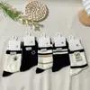 Calcetines Nuevos para Mujer Otoño e Invierno Estilo Grano Oso de Dibujos Animados Lindo Calcetines de Media Pantorrilla Estilo Japonés y Coreano Estilo Ins Calcetines de Algodón Estudiante Blanco y Negro