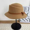 Nuevo Estilo Coreano Otoño/Invierno Estilo Hepburn Mezcla de Lana Cálido Moda Versátil Sombrero de Pescador Lazo Hace que la Cara se Vea Más Pequeña Moderno