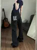 Jeans de color irregular con bloques de lunares para hombres y mujeres, muy populares, negros y blancos con eslogan de letras, nicho de alta gama, ligeramente atrevidos, de pierna recta