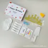 Conjunto de acessórios para bolo Fábrica Ningjin conjunto de sete peças em caixa velas de aniversário chapéu de coroa faca garfo prato de plástico descartável