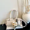 Bolso de mano de alta gama para mujer 2026 nueva moda nicho bolso cojín tejido exquisito bolso de hombro cruzado para el día a día