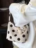 Bolso de mujer de moda de lunares de nicho estilo coreano 2026 nuevo bolso de hombro para el verano bolso de cubo pequeño elegante