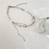 Diseño de nicho Collar de cristal perla esmerilado para mujer Collar de cadena de clavícula suelta irregular con borlas apiladas