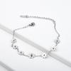 Acero de titanio 18K galvanizado no se decolora pequeño fresco adornos para el pie siete florecillas tobillera femenina japonesa y coreana margarita moda cuerda para el pie