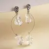 Pendientes de borla de flor de concha blanca transfronterizos europeos y americanos con perlas, pendientes de estilo de corte francés, pendientes ligeros y lujosos con un toque de alta gama