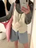 Nuevo chaleco exterior sin mangas fino para mujer de punto suelto liso con cuello en V, estampado de corazón, en capas, corto, para principios de otoño 2026