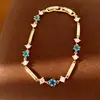 Pulsera con cierre de estrella de circonita chapada en oro real de 18k, sensación de lujo ligero de nicho de alta gama, accesorio de mano versátil y elegante