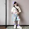 Conjunto de Manga Corta para Niña Verano 2026 Nuevo Estilo Niños Mayores Casual Pantalones de Cinco Puntos Conjunto de Verano Shorts de Mezclilla Pintados Conjunto de Dos Piezas