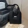 Bolso de Ocio de Nicho para Mujer 2025 Nuevo Bolso de Hombro Rayado de Pana Estudiante Viajero Plegado Bolso Temprano de Ocho Bajo el Brazo