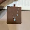 Plata de Ley S925 Diamante de Alto Carbono Paraíba Anillo de Carrera Collar de Trébol de Cuatro Hojas Nuevo Popular Nicho Lujo Ligero Gama Alta