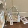 Bolso de axila de diseño de nicho versátil de moda transfronterizo, bolso cruzado de gran capacidad de alta gama, bolso tipo dumpling con bloques de color para commuters