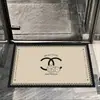 Alfombrilla de suelo floral de tierra de diatomeas de nuevo estilo en un estilo de lujo ligero, absorbe el agua y se seca rápidamente, felpudo antideslizante para entrada de baño
