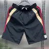 Verano 2026 Nuevo Estilo Japonés Simple Color Sólido Secado Rápido Pantalones Cortos Finos para Hombre Casual Cintura Elástica Holgados de Cinco Puntos