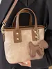 Bolsos de Nicho de Estilo Occidental de Moda 2026 Primavera Nuevo Bolso de Hombro Cruzado Vintage Bolso de Mano de Moda Bolso Cubo para Mujer