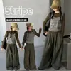 Ropa de niña transfronteriza, camiseta básica de algodón puro, nuevo modelo 2026, elegante camiseta a rayas de imitación de dos piezas para niños y preadolescentes, venta al por mayor