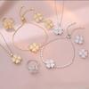 Collar de mujer con diseño de celebridad de internet, moderno conjunto de tres piezas con amor transfronterizo, pendientes giratorios, anillo y collar con microincrustaciones de circonitas en la clavícula.