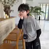 Sudadera Cotton Shop para Niños Estilo Coreano Otoño 2026 Nueva Marca de Moda Manga Larga Falsa Dos Piezas Conjunto Versátil de Ropa para Niños