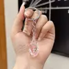 Chaveiro de Pingente de Concha Luminosa Simulada Acrílica Transparente Transfronteiriço para Casal Chaveiro Feminino Joias Atacado