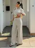 Verão 2026 Novo Conjunto de Duas Peças Calça Pantalona de Malha Listrada de Manga Curta Conjunto de Moda Casual Feminino Roupas Femininas Transfronteiriças