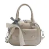 Bolsa de Concha de Verão Elegante e da Moda para Mulheres 2025 Nova Cor Sólida Versão Coreana Bolsa de Ombro Único Versátil Bolsa Transversal
