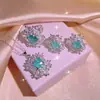 Conjunto de joyería de tres piezas para mujer, conjunto de pendientes cuadrados de paraipa europeos y americanos con anillo de circonita y flores