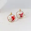 Aretes exquisitos de flor real de venta caliente transfronteriza resina gota pegamento joyería de flor seca aretes nomeolvides joyería artesanal al por mayor