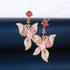 Pendientes de mariposa elegantes súper hada de lujo color degradado circonita micro incrustada temperamento pétalos aguja de plata s925 pendientes al por mayor