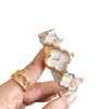 Reloj para Mujer con Logo Personalizado Trébol de Cuatro Hojas Pulsera Negra Dorada Reloj para Mujer Estilo Pulsera Venta al por Mayor Transfronteriza Reloj Impermeable