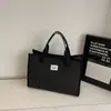 Bolsa Xadrez Casual de Grande Capacidade 2025 Nova Bolsa Tote para Estudante e Comutador Bolsa Transversal Casual com Textura Contrastante